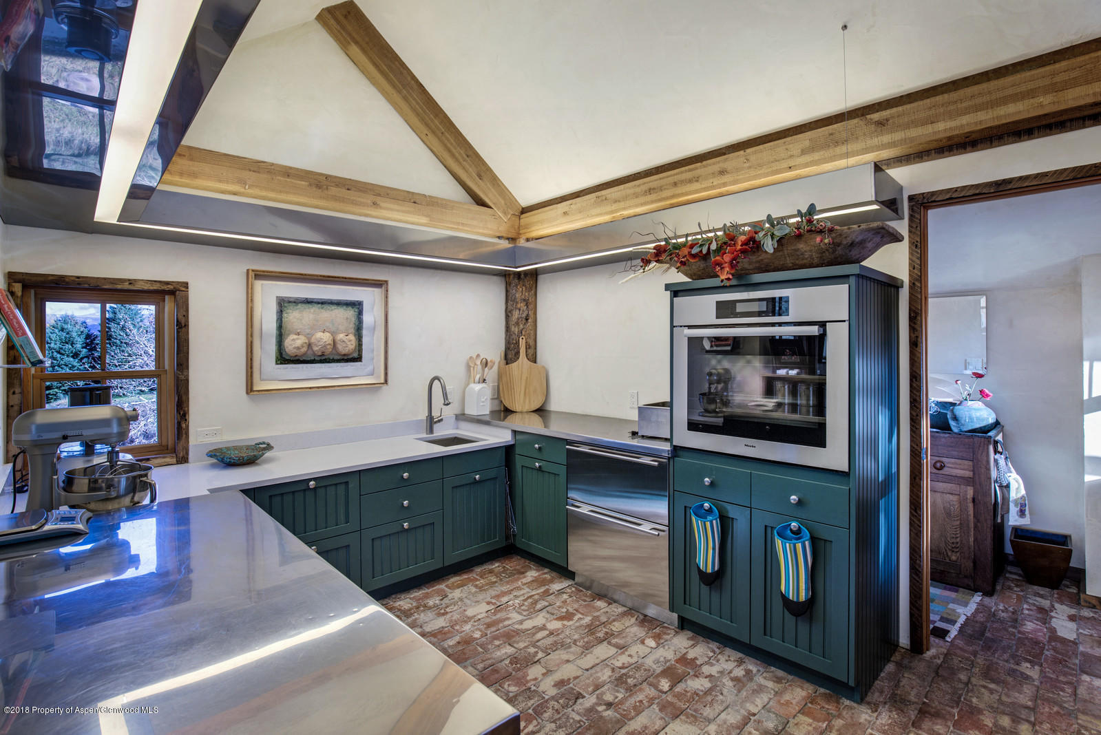 314 Diamond A Ranch Road Carbondale, CO 81623 - Photo 13 of 40 a kitchen with stainless steel appliances granite countertop a sink and cabinets
