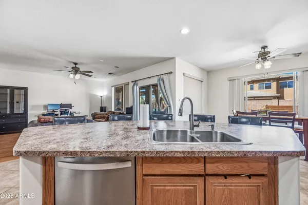 a kitchen with granite countertop a sink and center island
