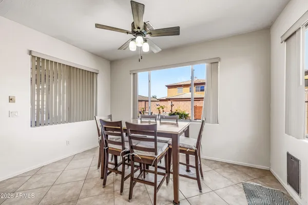 a view of a dining room with furniture and window