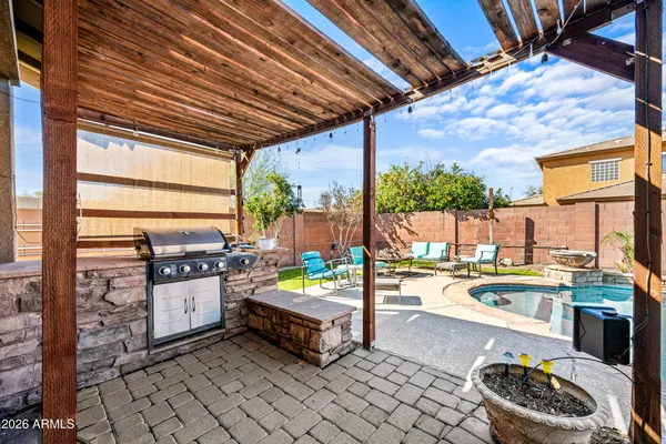 a kitchen with stainless steel appliances kitchen island granite countertop a sink and cabinets