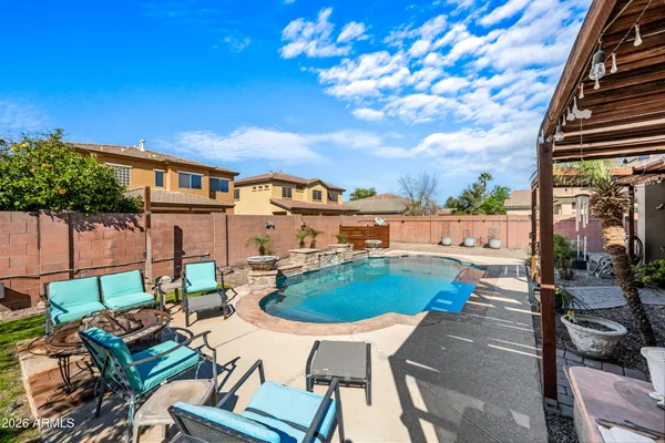 a balcony with furniture and a potted plant