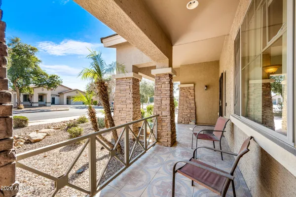 a view of a balcony with chairs