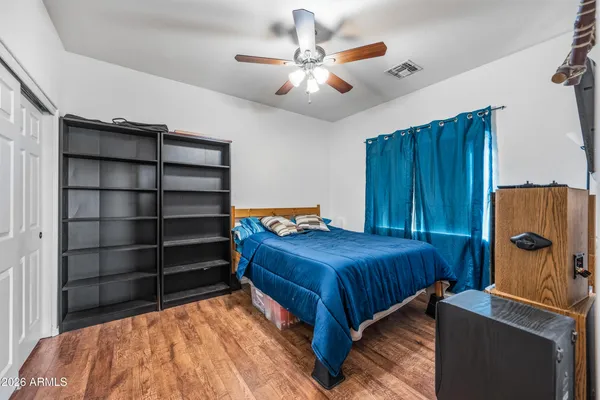 a bathroom with a bathtub a sink and a large mirror