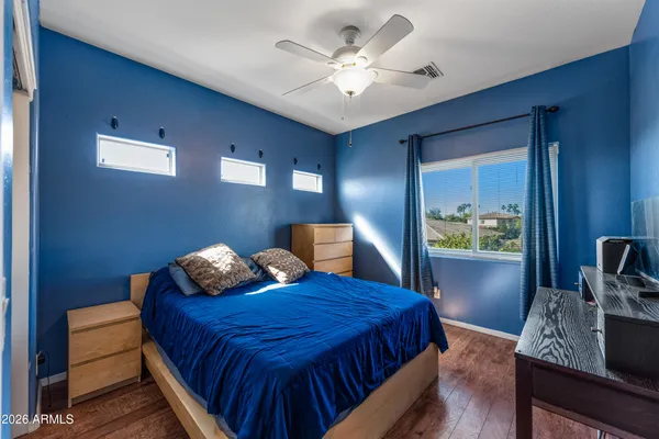 a view of a workspace with furniture and a flat screen tv