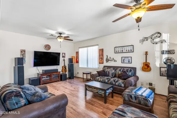 a living room with furniture and a flat screen tv