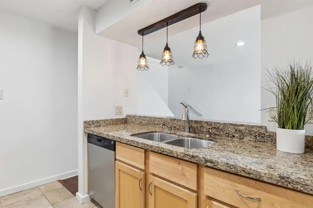 a bathroom with a sink and vanity
