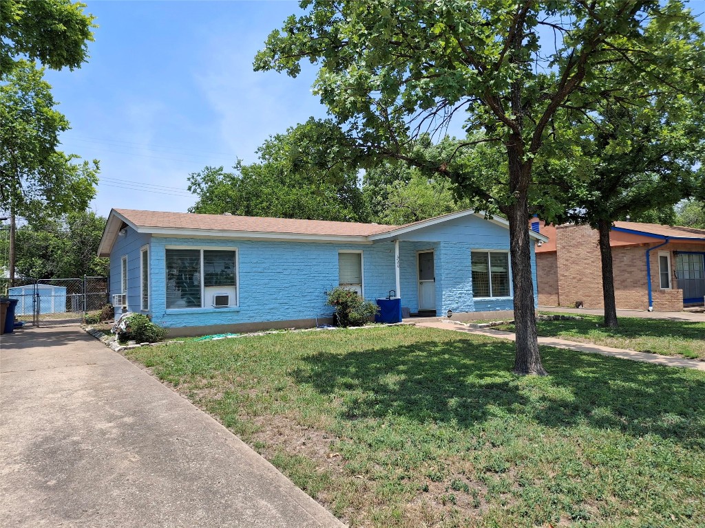 7520 Delafield Lane Austin, TX 78752 - Photo 1 of 9 a house that has sitting area in front of it