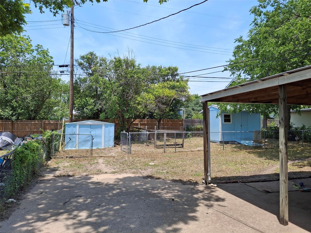 7520 Delafield Lane Austin, TX 78752 - Photo 5 of 9 a view of a patio with table and chairs and wooden fence
