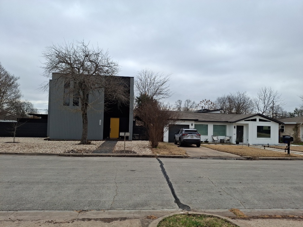 7520 Delafield Lane Austin, TX 78752 - Photo 7 of 9 a front view of a house with a yard