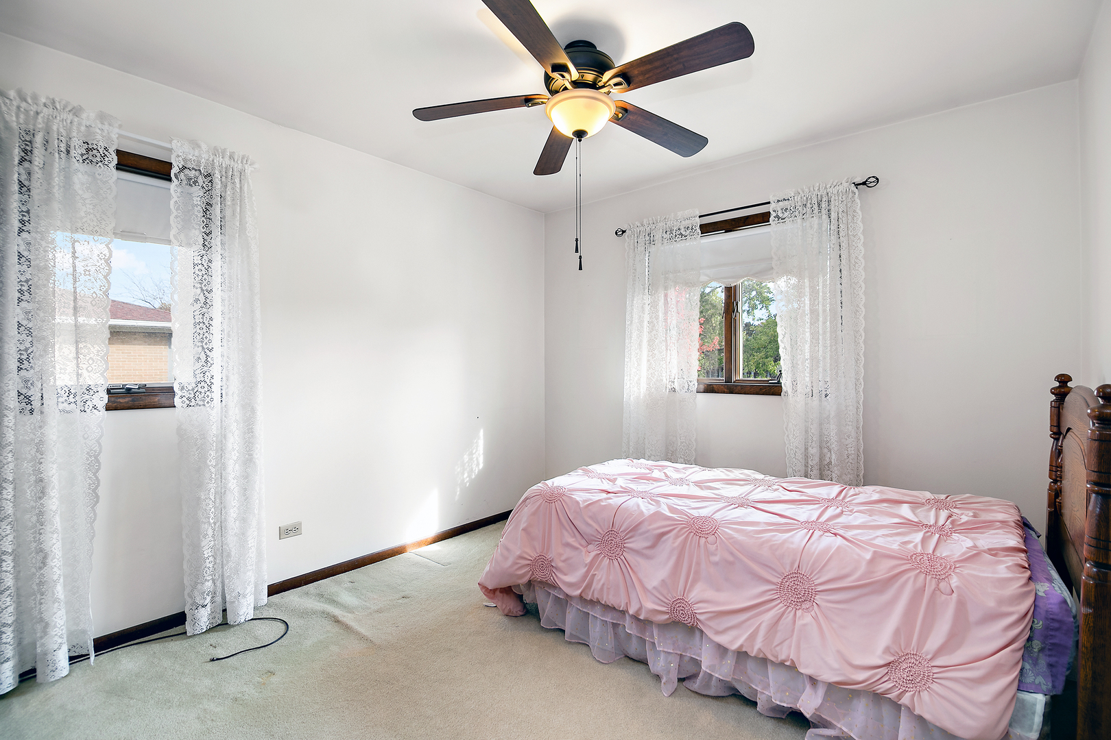 15124 Chestnut Lane Oak Forest, IL 60452 - Photo 11 of 18 a bedroom with a bed and a chandelier