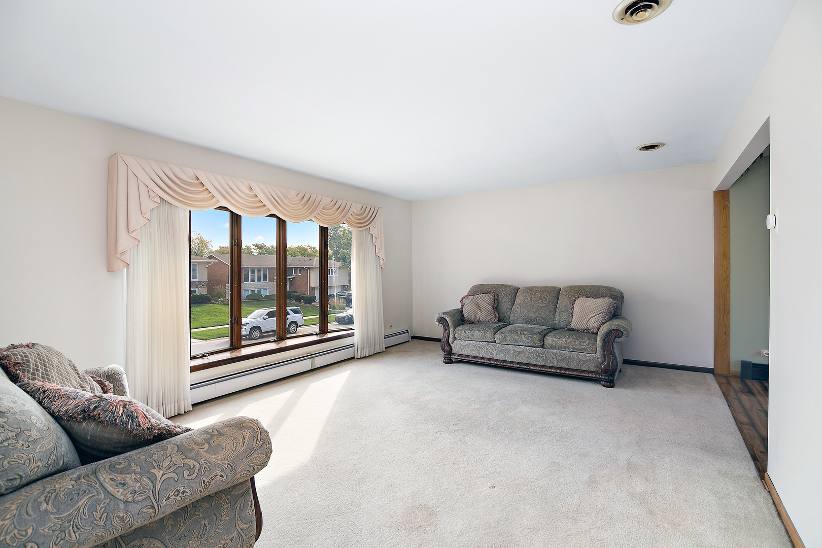 15124 Chestnut Lane Oak Forest, IL 60452 - Photo 2 of 18 a living room with furniture and a large window