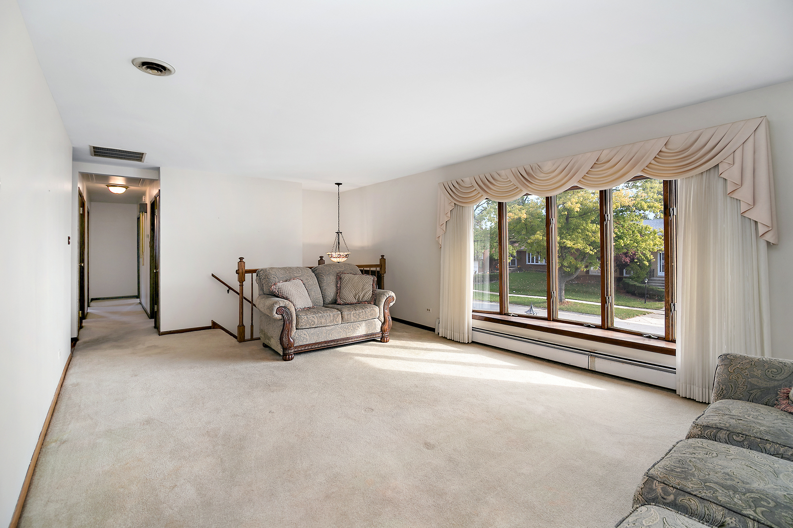 15124 Chestnut Lane Oak Forest, IL 60452 - Photo 3 of 18 a living room with furniture and a large window