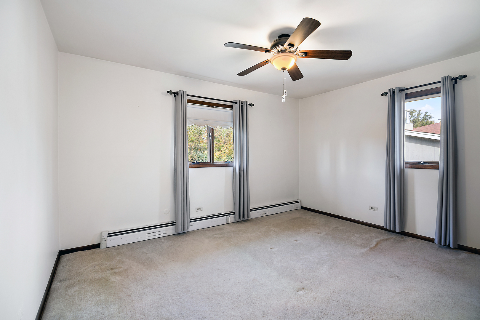 15124 Chestnut Lane Oak Forest, IL 60452 - Photo 10 of 18 an empty room with closet and a ceiling fan