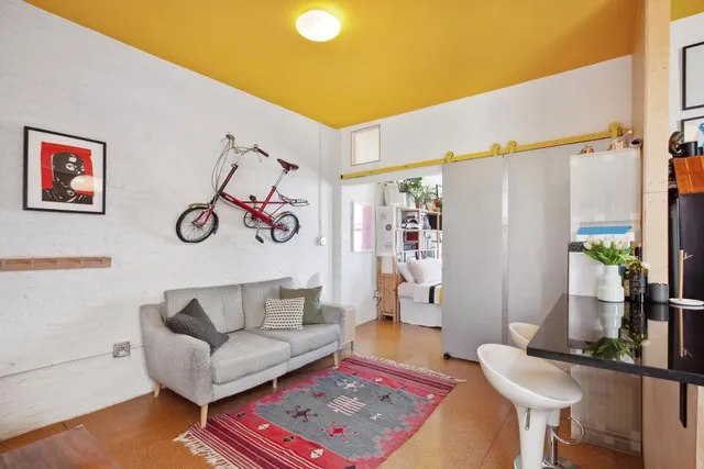 a living room with furniture and a rug