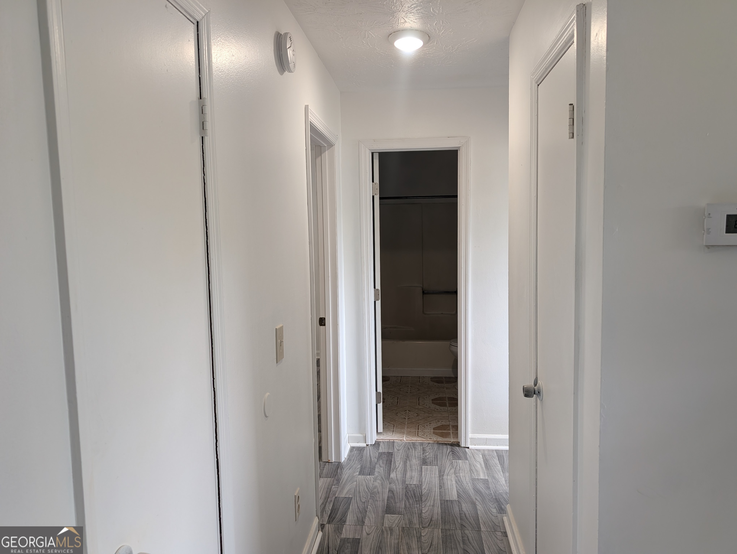 460 Rustwood Drive Athens, GA 30606 - Photo 5 of 7 a view of hallway with wooden floor