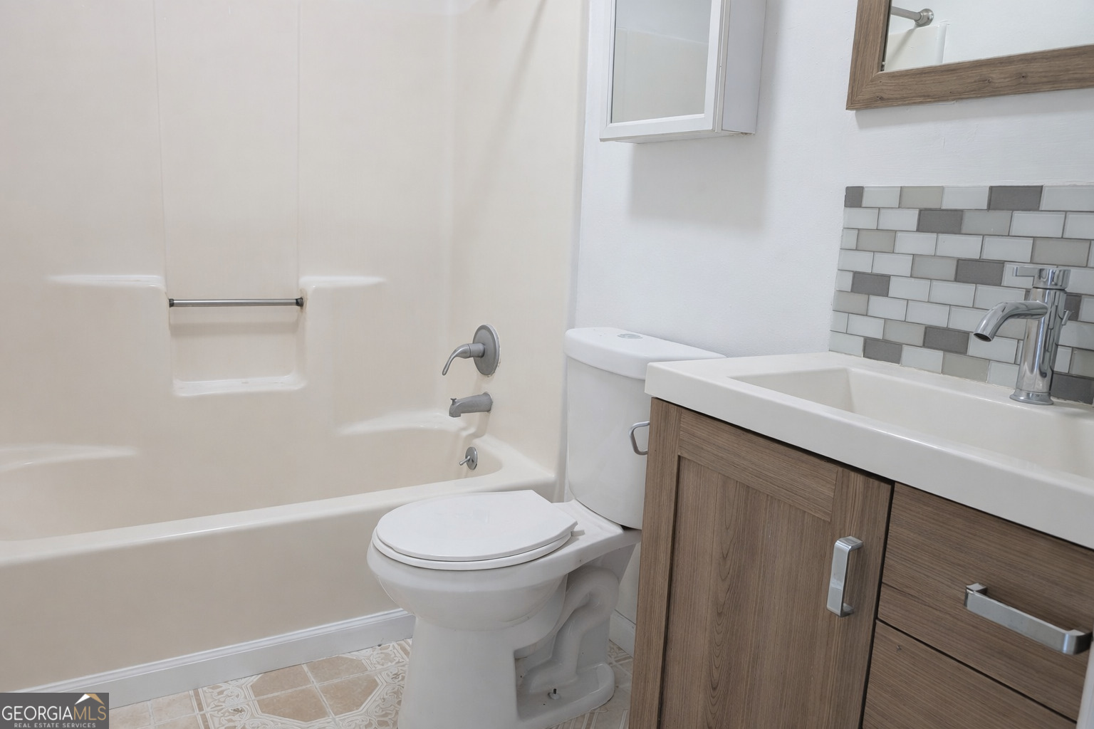 460 Rustwood Drive Athens, GA 30606 - Photo 6 of 7 a bathroom with a sink a toilet and shower