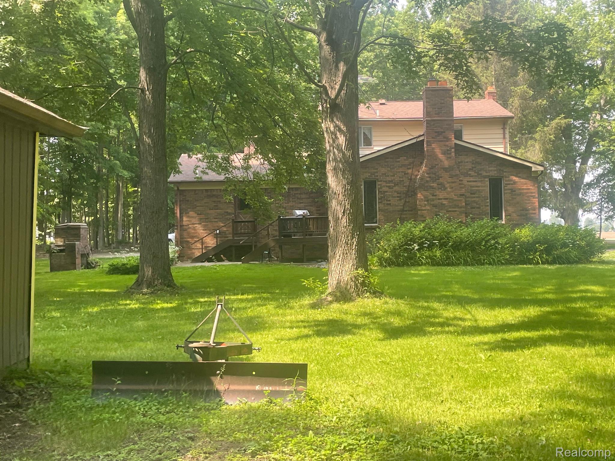 16255 Hough Road Allenton, MI 48002 - Photo 4 of 18 Summer photo of rear