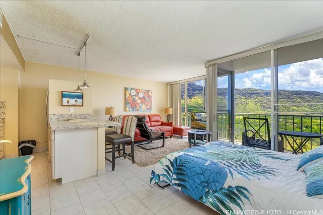 a living room with furniture and large windows