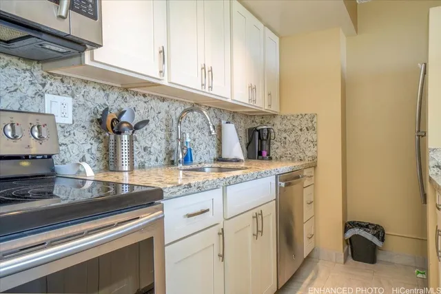 a view of a kitchen with sink and cabinets