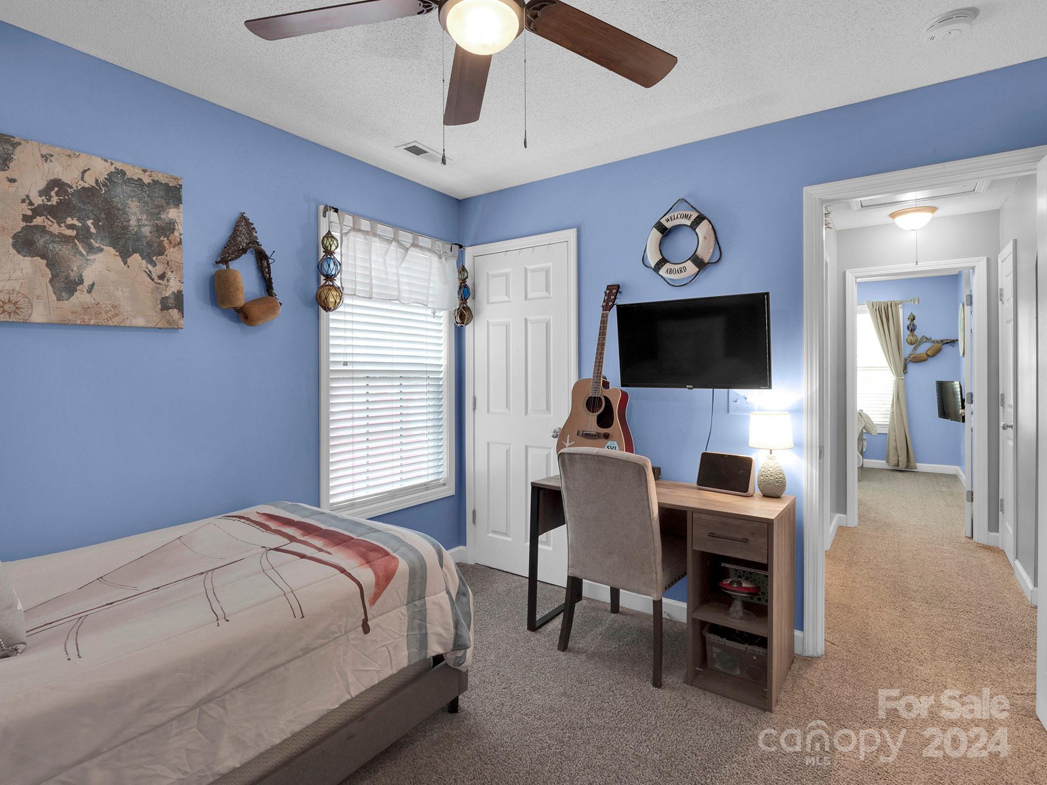 321 Springlake Road York, SC 29745 - Photo 23 of 34 a bedroom with a bed and a flat screen tv