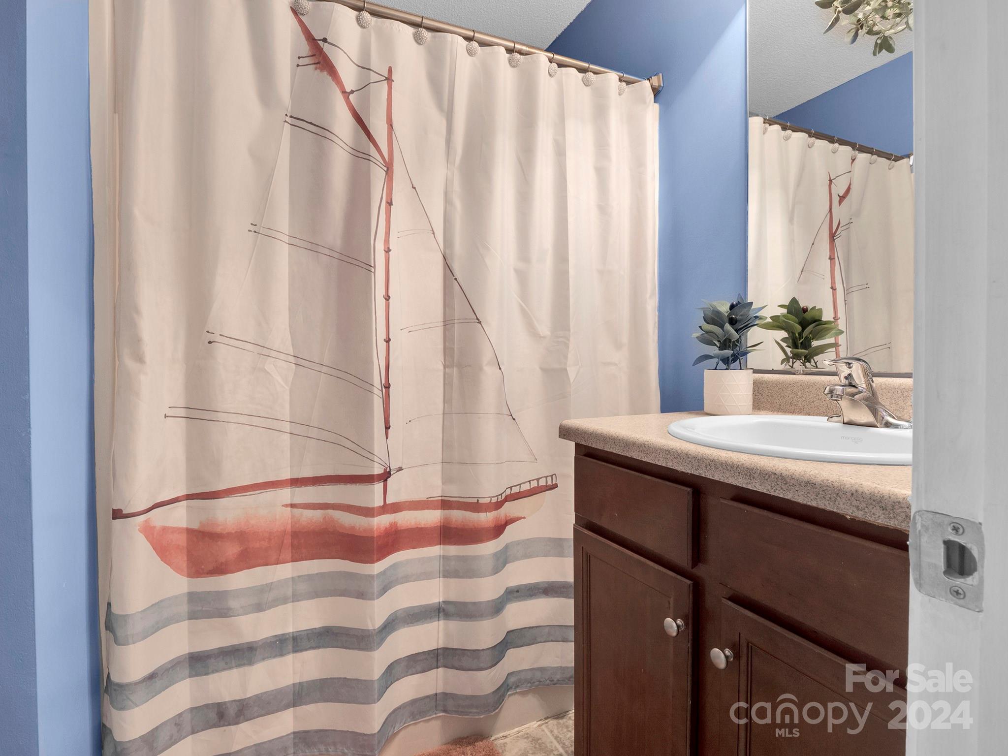 321 Springlake Road York, SC 29745 - Photo 26 of 34 a bathroom with a sink and a mirror