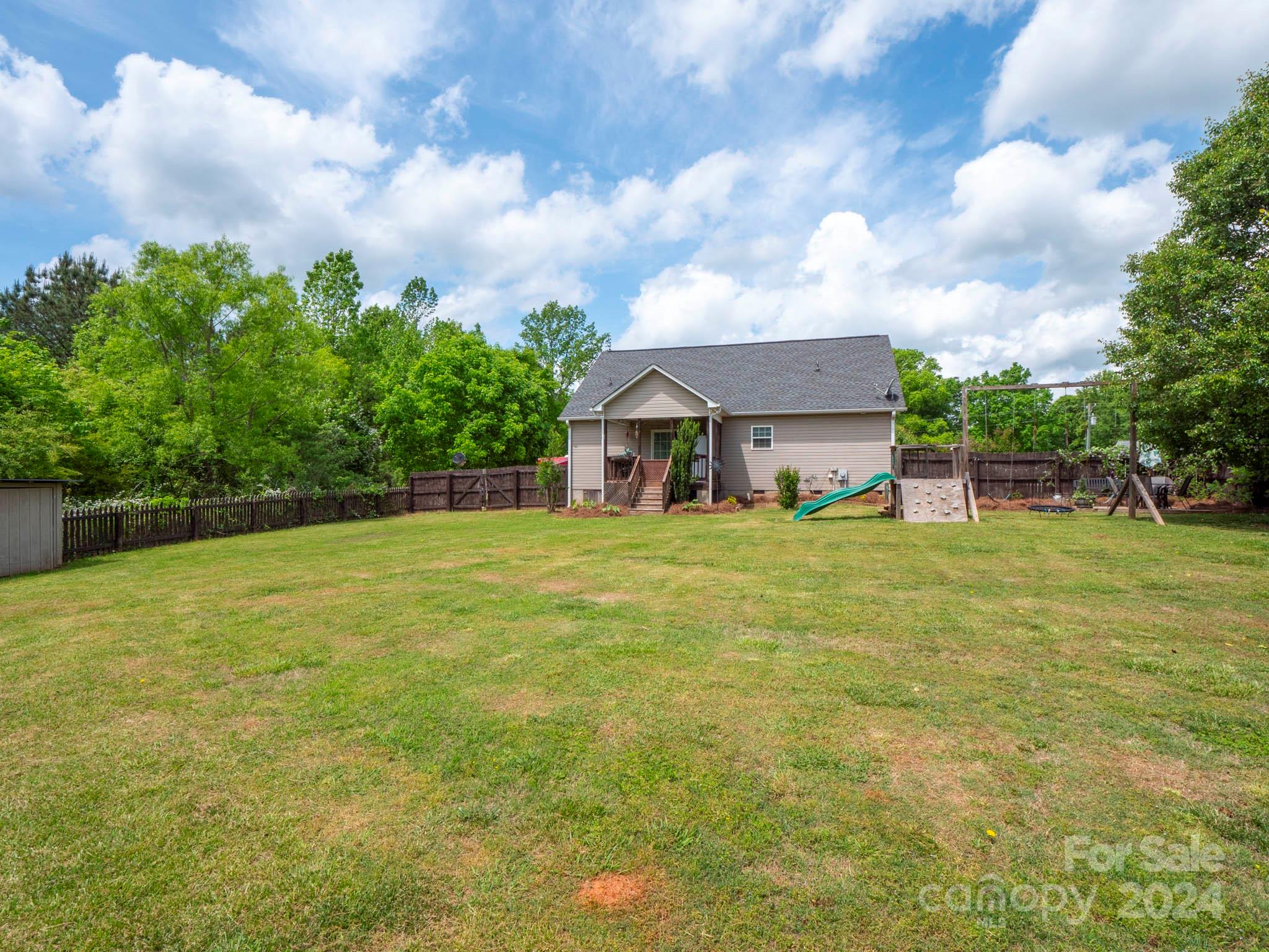321 Springlake Road York, SC 29745 - Photo 32 of 34 a house view with garden space and wooden fence