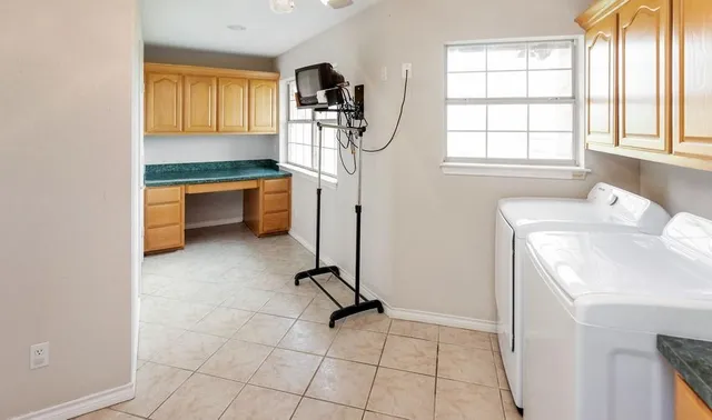 a view of room with window and refrigerator