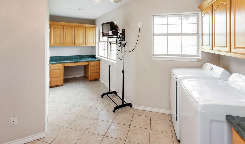 2290 County Road Honey Grove, TX 75446 - Photo 15 of 37 a view of room with window and refrigerator
