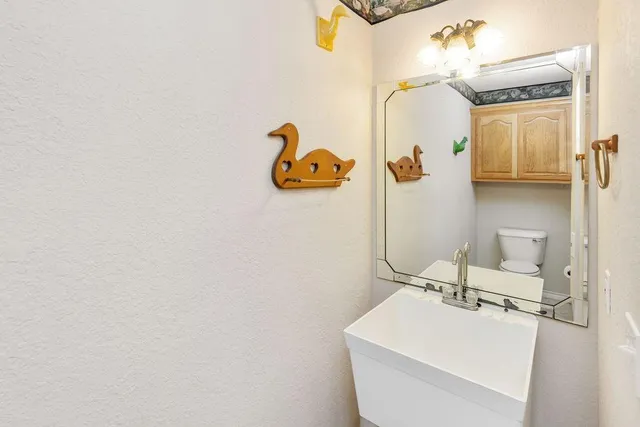 a bathroom with a sink and mirror