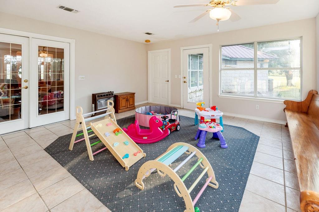 2290 County Road Honey Grove, TX 75446 - Photo 24 of 37 a living room with furniture and wooden floor