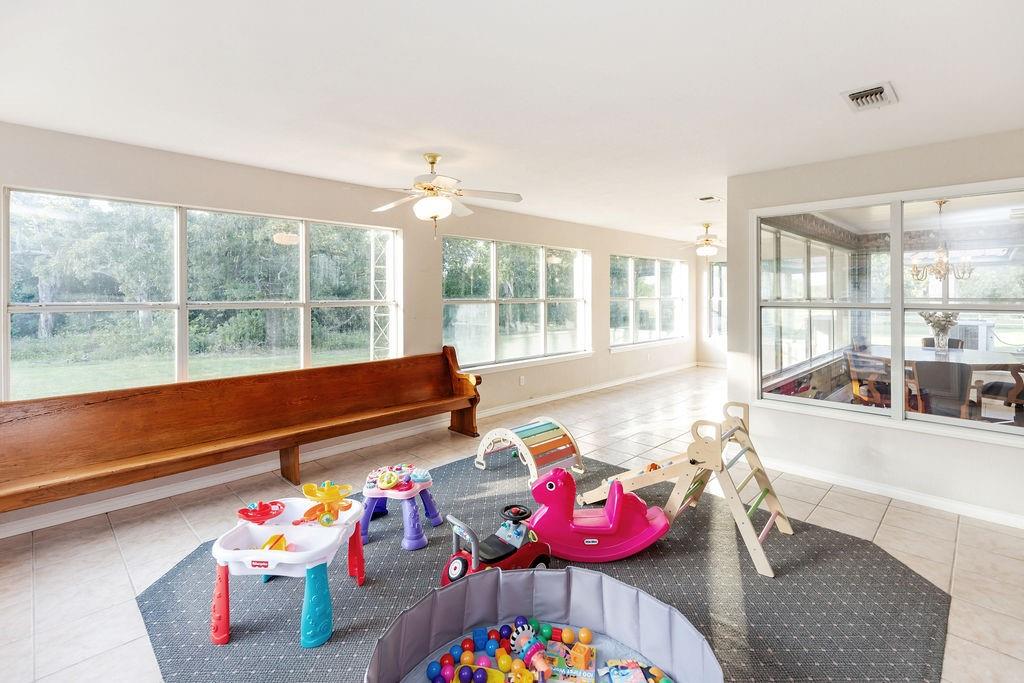 2290 County Road Honey Grove, TX 75446 - Photo 25 of 37 a living room with baby toys