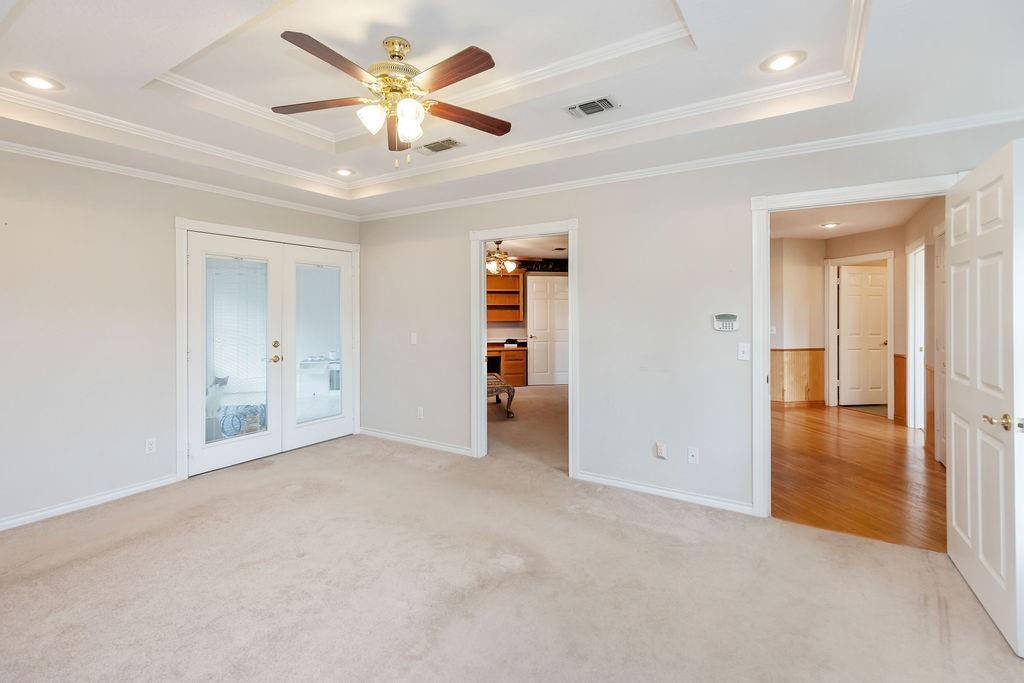 2290 County Road Honey Grove, TX 75446 - Photo 27 of 37 an empty room with closet and a ceiling fan