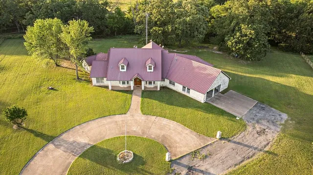 an aerial view of a house with a garden