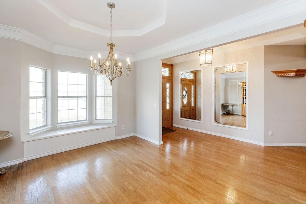2290 County Road Honey Grove, TX 75446 - Photo 6 of 37 a view of livingroom with window and wooden floor