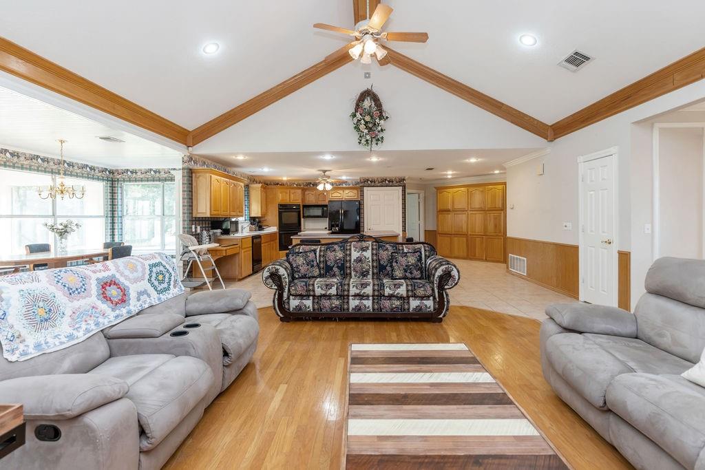 2290 County Road Honey Grove, TX 75446 - Photo 10 of 37 a living room with furniture ceiling fan and a rug