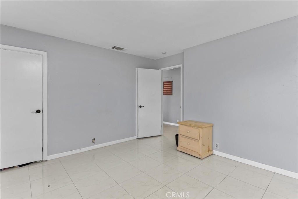 13447 Iroquois Road Apple Valley, CA 92308 - Photo 22 of 45 a view of room with white walls