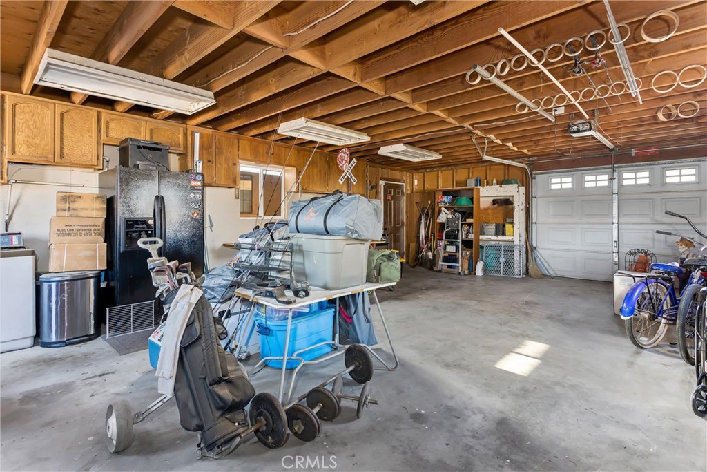 13447 Iroquois Road Apple Valley, CA 92308 - Photo 39 of 45 a view of a storage room with a lot of stuff