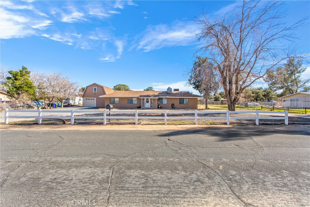 13447 Iroquois Road Apple Valley, CA 92308 - Photo 4 of 45 a house view with a swimming pool and sitting area