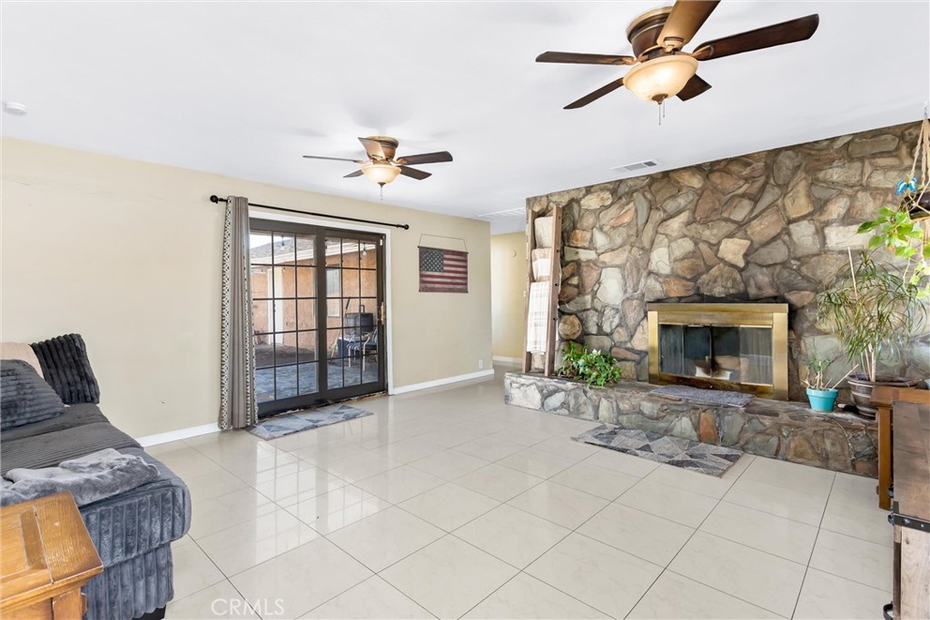 13447 Iroquois Road Apple Valley, CA 92308 - Photo 6 of 45 a view of a livingroom with furniture and a fireplace