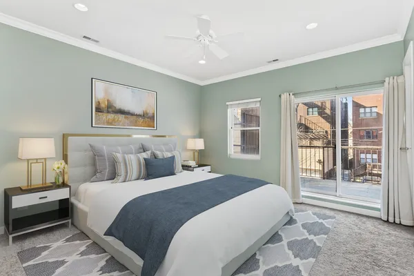 a spacious bedroom with a large bed and a window
