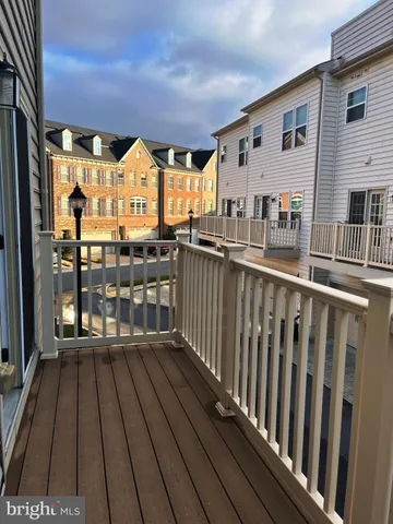 a view of a balcony with wooden floor