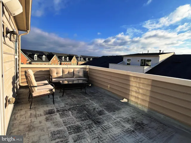 a view of city from balcony with outdoor seating
