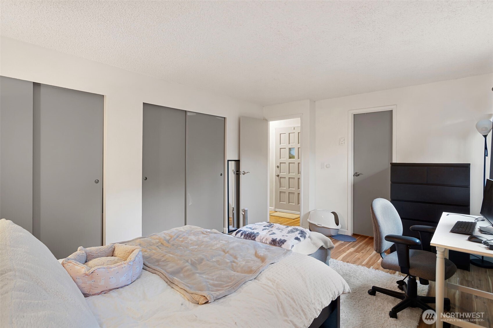 17301 Northeast 45th Street, Unit 87 Redmond, WA 98052 - Photo 13 of 20 a bedroom with a bed a desk and chair