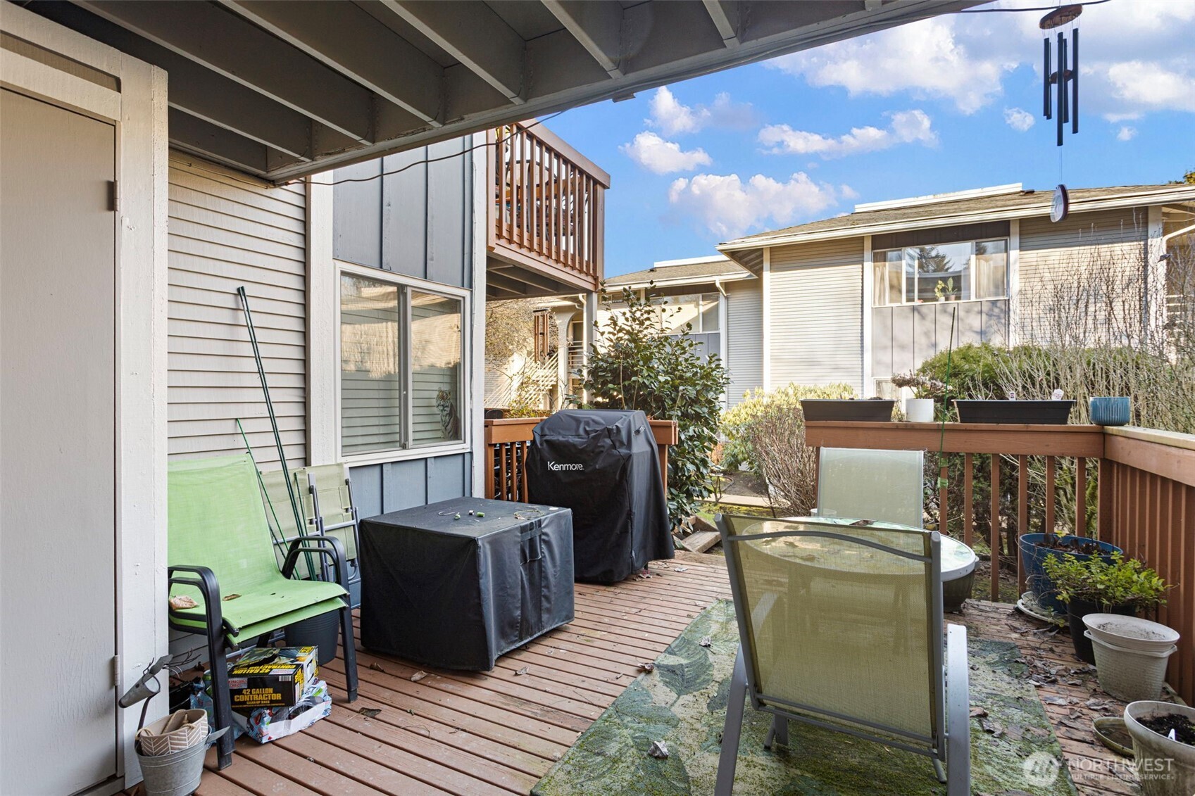 17301 Northeast 45th Street, Unit 87 Redmond, WA 98052 - Photo 16 of 20 a living room with furniture and a floor to ceiling window