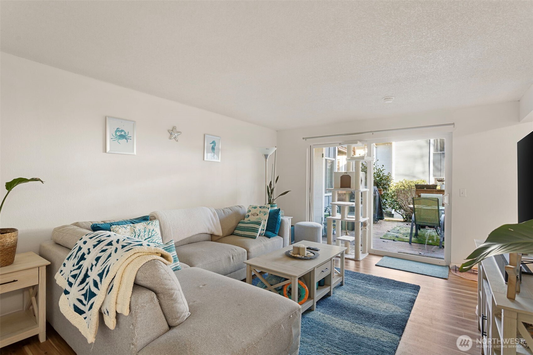 17301 Northeast 45th Street, Unit 87 Redmond, WA 98052 - Photo 2 of 20 a living room with furniture and wooden floor