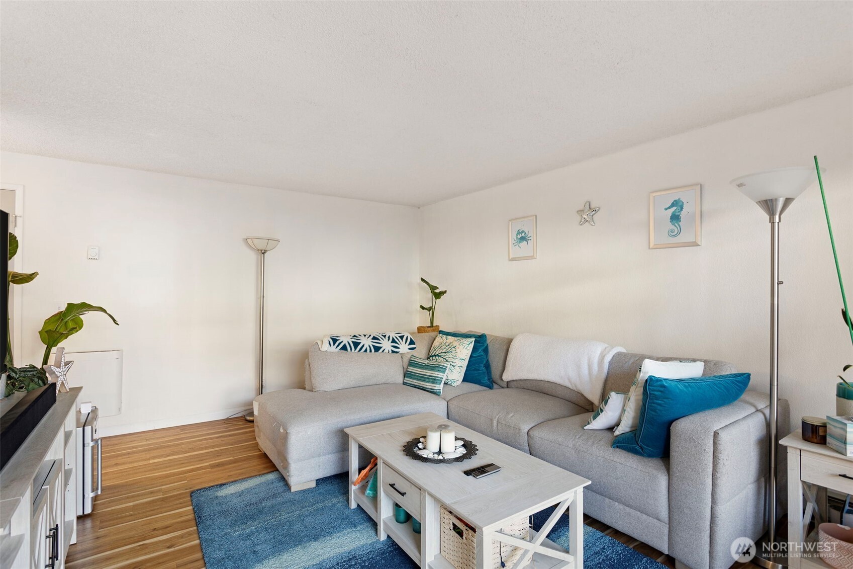 17301 Northeast 45th Street, Unit 87 Redmond, WA 98052 - Photo 4 of 20 a living room with furniture and wooden floor
