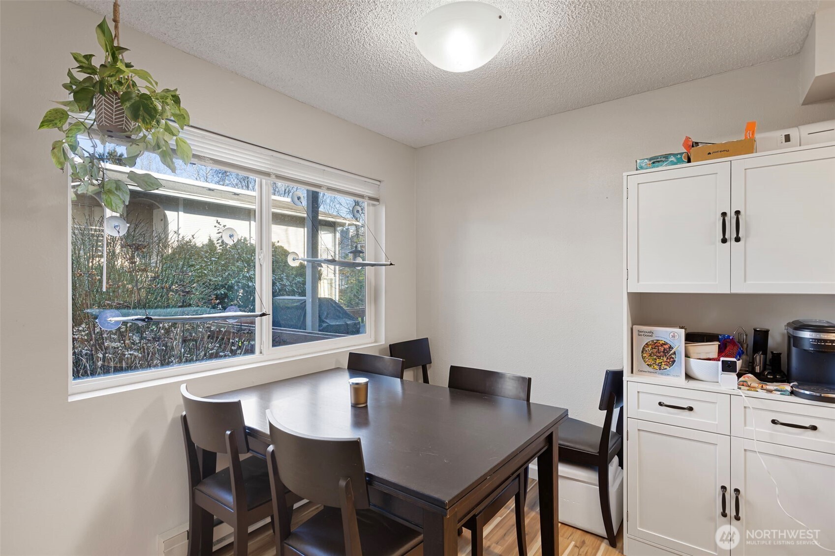 17301 Northeast 45th Street, Unit 87 Redmond, WA 98052 - Photo 7 of 20 a view of a dining room with furniture window and outside view