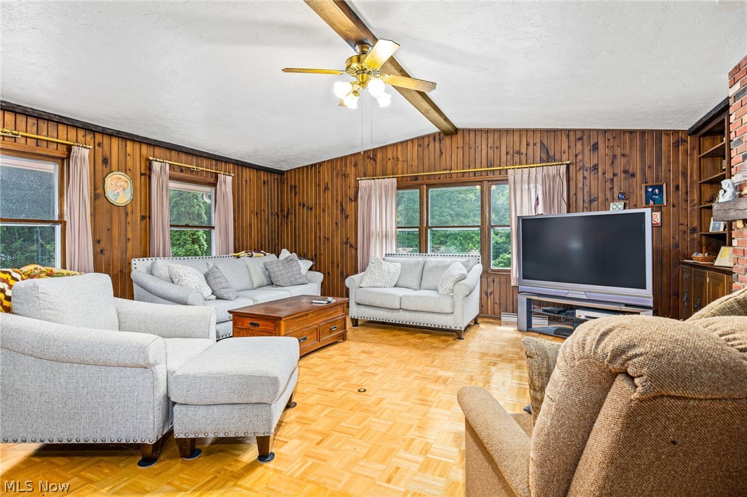 3070 Hamilton Road Medina, OH 44256 - Photo 13 of 34 Wood-paneled walls, exposed wood ceiling beams, and parquet flooring