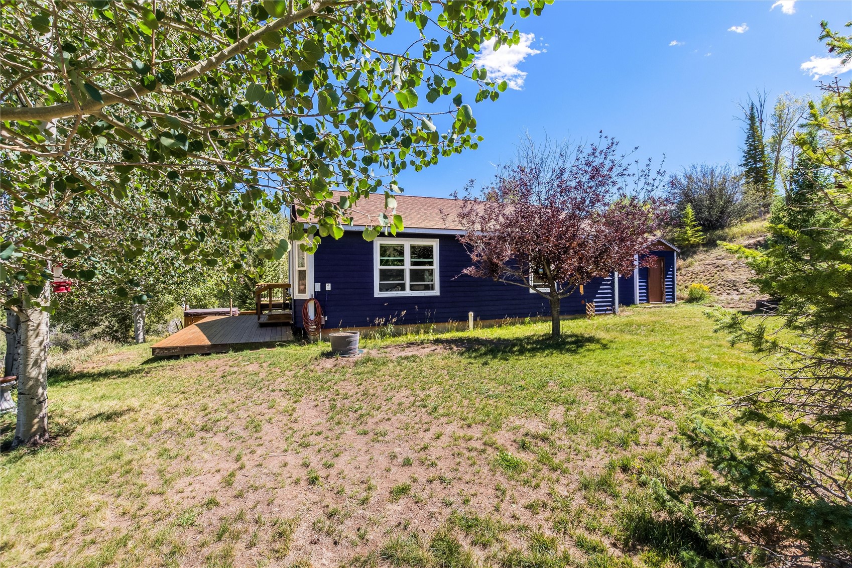11 Blue Ridge Street Heeney, CO 80498 - Photo 32 of 45 The flat yard is the perfect canvas for additional landscaping, backyard acitivies, an addition to the current home, or more.