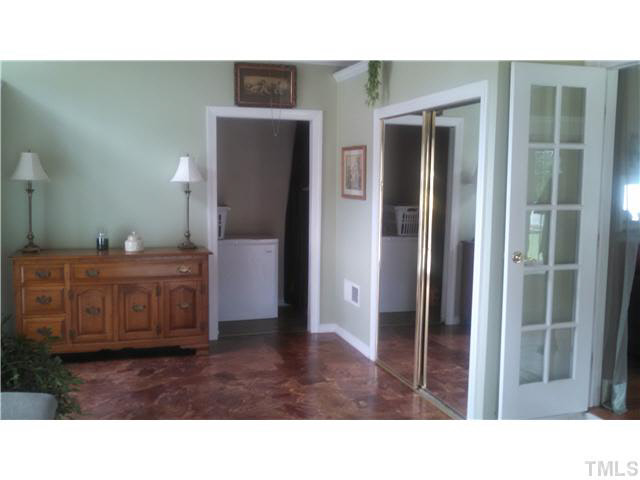 313 Pine Tree Road Oxford, NC 27565 - Photo 12 of 17 view into utility room and large closet on right French doors back into the living room